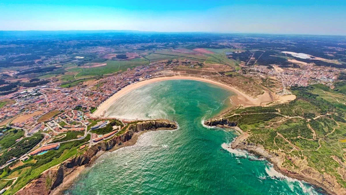 Visiting Lisbon? This Shell-Shaped Beach Is Just Over 1 Hour Away